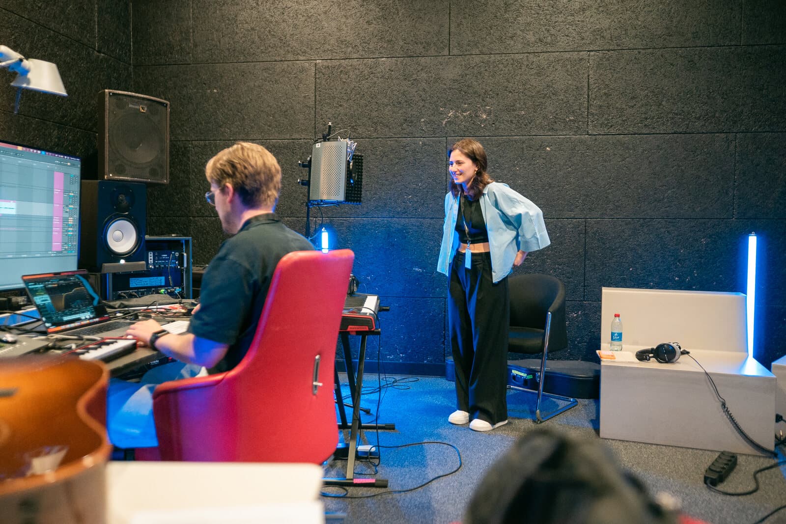 Artist and collaborators working in a Luxembourg studio